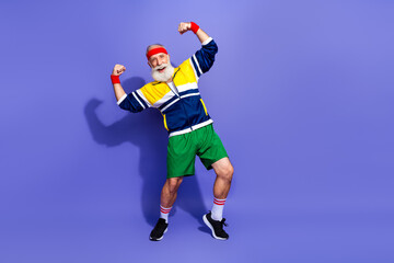 Elderly man sporting vintage athletic attire flexing energetically in a confident pose, expressing fitness and enthusiasm