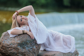 Beautiful Girl with long hair swims and dances in water