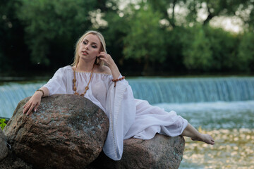 Beautiful Girl with long hair swims and dances in water