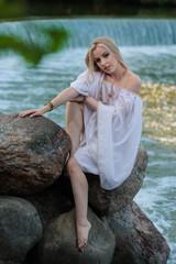 Beautiful Girl with long hair swims and dances in water