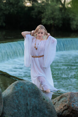 Beautiful Girl with long hair swims and dances in water