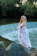 Beautiful Girl with long hair sitting in water