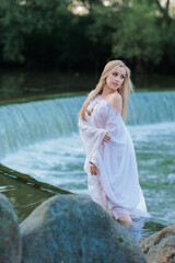 Beautiful Girl with long hair swims and dances in water