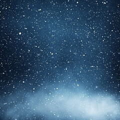 Fototapeta premium Beautiful white snow falls gently down from the dark blue winter sky creating a tranquil scene background texture overlay during cold weather