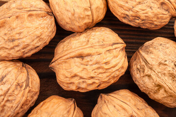 walnuts group on wood background top view