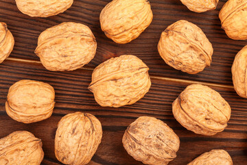 walnuts group on wood background top view