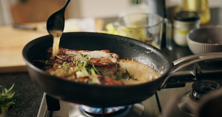 Cooking, steak and pan for meal, kitchen and preparation for dinner in restaurant, seasoning or cuisine. Catering business, ingredients and culinary skills for food in diner, spoon or herb for flavor