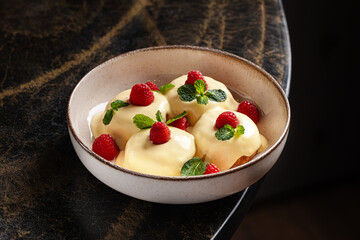 Syrniki with Vanilla Sauce and Raspberries.
Classic cottage cheese pancakes topped with creamy vanilla sauce, fresh raspberries, and mint leaves — a beloved Eastern European dessert.
