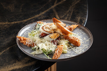 Caesar Salad with Crispy Chicken – Classic Caesar salad with romaine lettuce, crispy breaded chicken strips, shaved Parmesan, croutons, and creamy Caesar dressing.