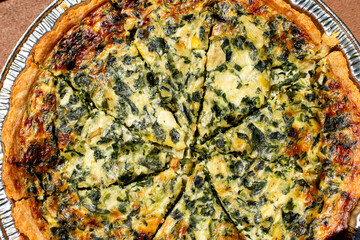 A close-up of a spinach quiche 