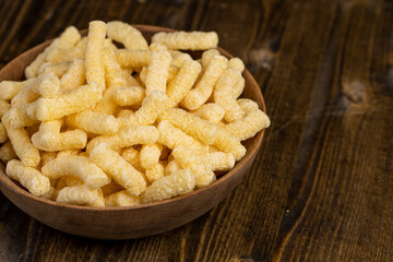 corn sticks closeup, a large number of corn sticks for eating or making breakfast with milk, corn sticks in a wooden bowl