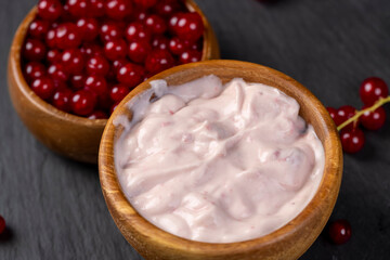 milk product with the addition of red sweet and sour currants and currant flavor, close up
