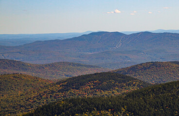 New England Autumn Landscape with Vibrant Fall Foliage and Mountain Views