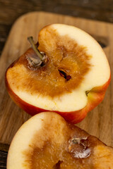 one rotting apple on the table