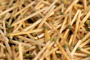 matches without matchboxes, closeup, a large number of wooden matches scattered in a large pile