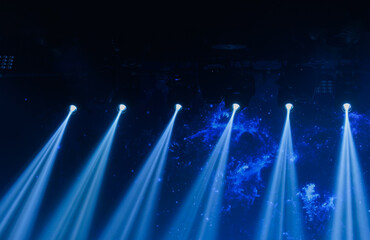An empty stage of the theater, lit by spotlights and smoke before the performance