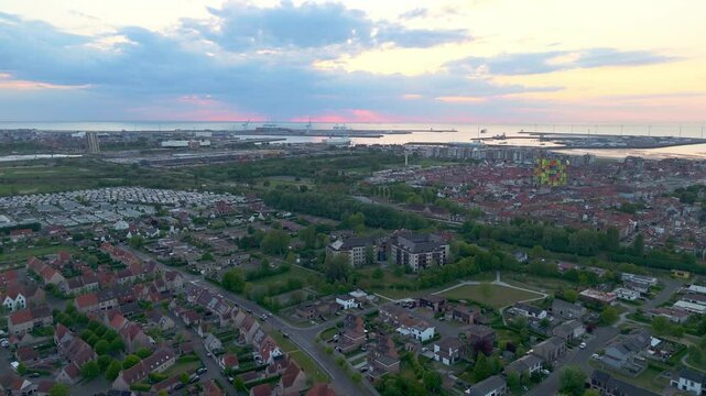 Aerial Flyover of Heulebrug with Distant Sea and Harbor View | FlyLens 4K