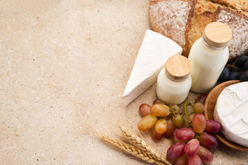 Jewish holiday Shavuot concept. Grains, milk and cheese on travertini stone background
