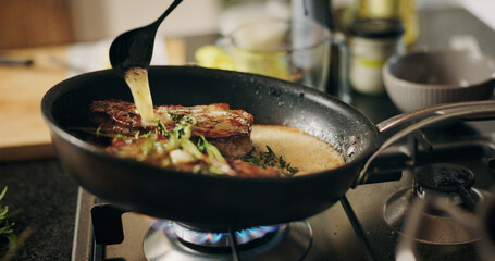 Cooking, stove or steak in pan with sauce in kitchen for culinary skill, recipe or meal prep for...