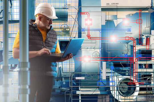 Engineer with helmet and laptop inspecting HVAC system blueprint over industrial ventilation equipment. &ndash; Engineering, HVAC, Industrial Maintenance, Building Systems.