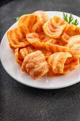 Chips bacon crispy rashers corn snacks fast food natural food fresh dish on the table rustic food top view copy space