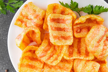 Chips bacon crispy rashers corn snacks fast food natural food fresh dish on the table rustic food top view copy space