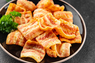 Chips bacon crispy rashers corn snacks fast food natural food fresh dish on the table rustic food...