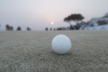 Golf ball nestled in dew-kissed dawn, evoking tranquil zen minimalism, perfect for National Golf Month or World Relaxation Day