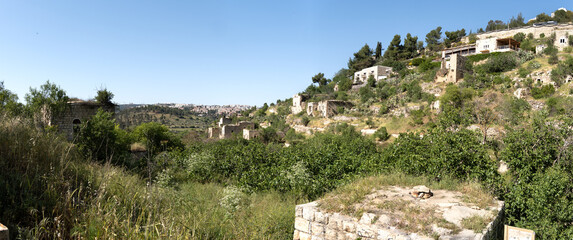 Panoramic view of ruined houses of an ancient arabian abandoned village Lifta located on hills near Jerusalem, Israel.