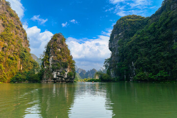 Fototapeta premium Scenic limestone karsts and tranquil waters in Ninh Binh, Vietnam
