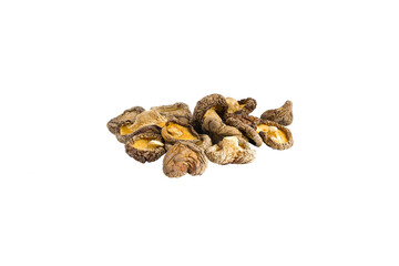 Dried shiitake mushrooms set on white highlight intricate textures and deep, savory hues in a balanced composition.