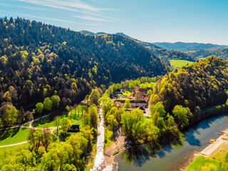 Peak Tri Koruny or Trzy Korony during day with green meadow and trees in spring. National park in Slovakia and Poland. © Zedspider