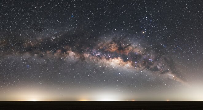 漆黒の夜空に輝く壮大な天の川 満天の星 (Shikkoku no yoru ni kagayaku soudai na ama no kawa manten no hoshi) This translates to: "Magnificent Milky Way shining in the inky black night sky, countless stars.". AI Generated