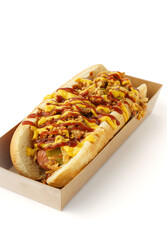 Fast food hot dog with ketchup drizzle on white background