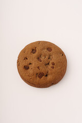 Round chocolate cookie on white background
