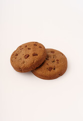 Brown cookies with chocolate chips on white background
