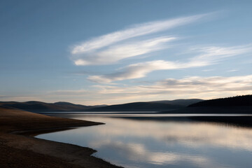 stunning reservoir edge in algeria at sunset showcasing dramatic contrasts of light and shadow