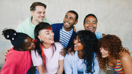 Diverse group of friends having fun smiling outdoor in summer day. Young people celebrate holiday vacations outside