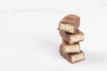 Vegan Chocolate Candy bar with coconut pulp. White background. Copy space