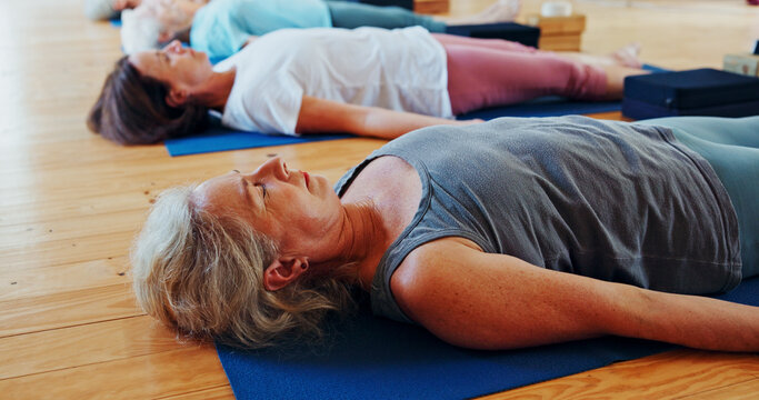 Relax, meditation and senior woman in class for calm, wellness and mindfulness with inner peace. Self care, health and female person with breathing on yoga mat for holistic healing, zen or balance.