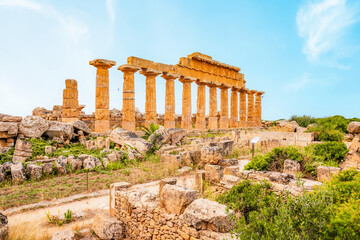 Fototapeta premium Greek temples at Selinunte of Temple of Apollo (C) with ruins of Greek columns in Selinunte Archaeological Park Sicily Italy