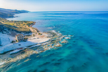 Punta Bianca, near Agrigento in Sicily Italy. Beach with ruins of an stone house on white cliffs.