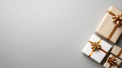 Wrapped gifts with golden ribbons and bows for celebration flat lay with copy space