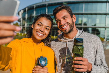 Sporty couple girl guy man woman friends sport workout fitness exercise fit make selfie photo with...