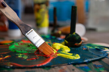 A Vibrant Palette Complete with Brush and Paints for Diverse and Creative Expression