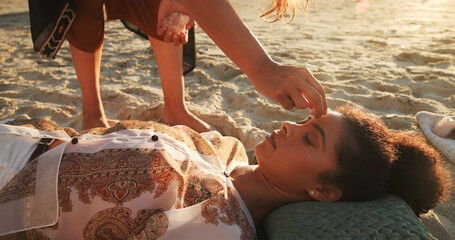 Woman, crystal and healing with chakra at beach with homeopath, energy and therapy with rest on vacation. People, rocks and holistic care with mineral, balance and peace with zen on ground in summer