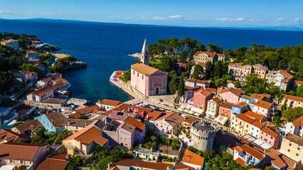 Fototapeten Enge Straßen Aerial view of Veli Lošinj (Losinj), charming historic town on the island of Mali Lošinj, Croatia. Colorful old architecture, narrow streets, and crystal Adriatic waters create stunning coastal scene  © Viktor