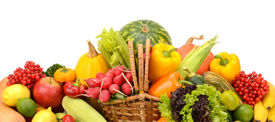 Healthy fresh vegetables and fruits in willow basket isolated on white