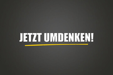 Jetzt umdenken (Now think again) - A blackboard with white text.