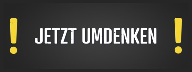 Jetzt umdenken (Now think again) - A blackboard illustration with white text.